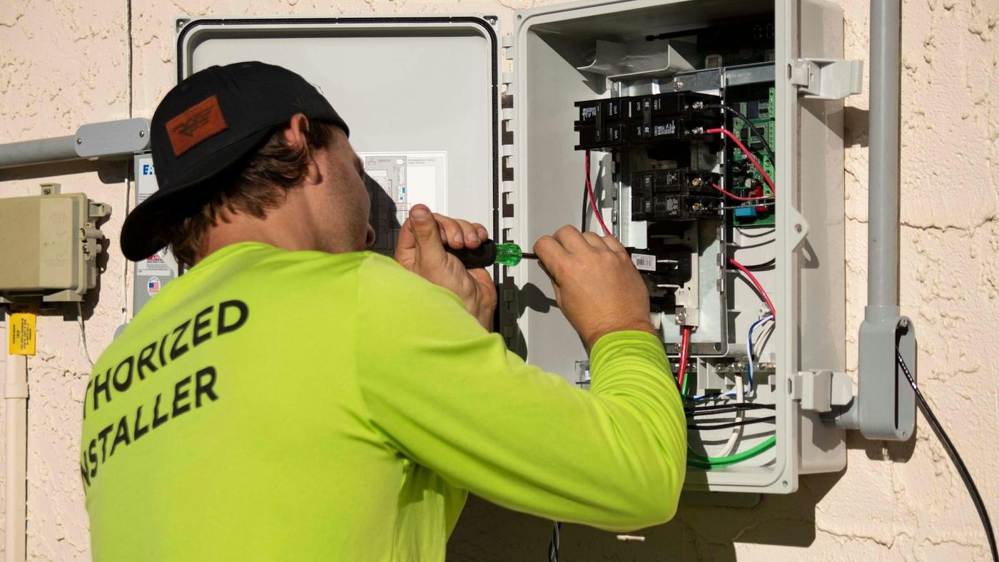 Electrician wiring a distribution panel