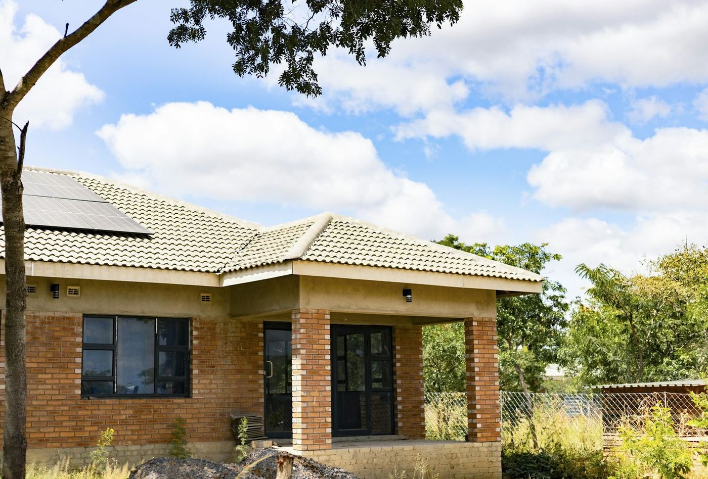 Solar panels on the tiled roof of a family home